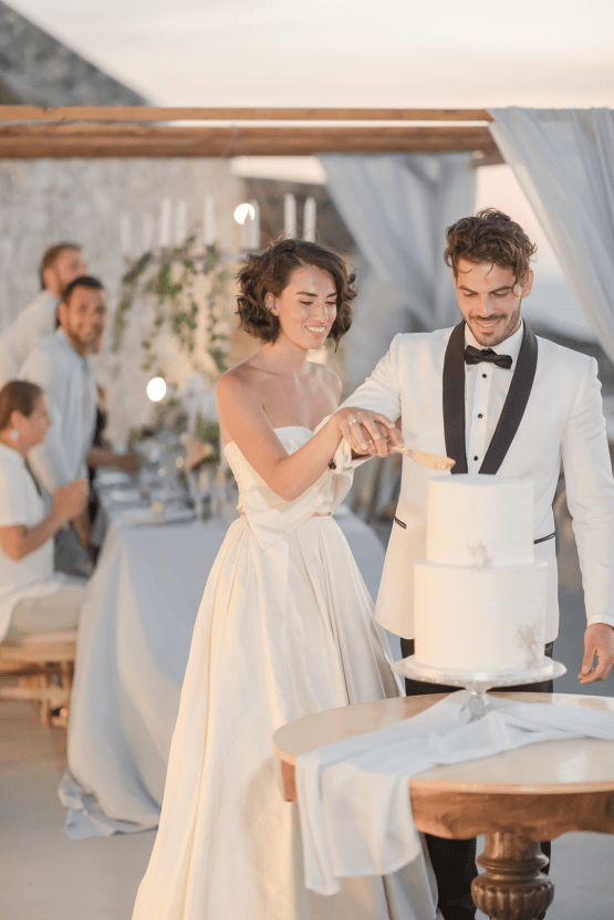 Pale Blue Greek Micro Wedding on the Cliffs of Santorini – Kimonas Photography 55